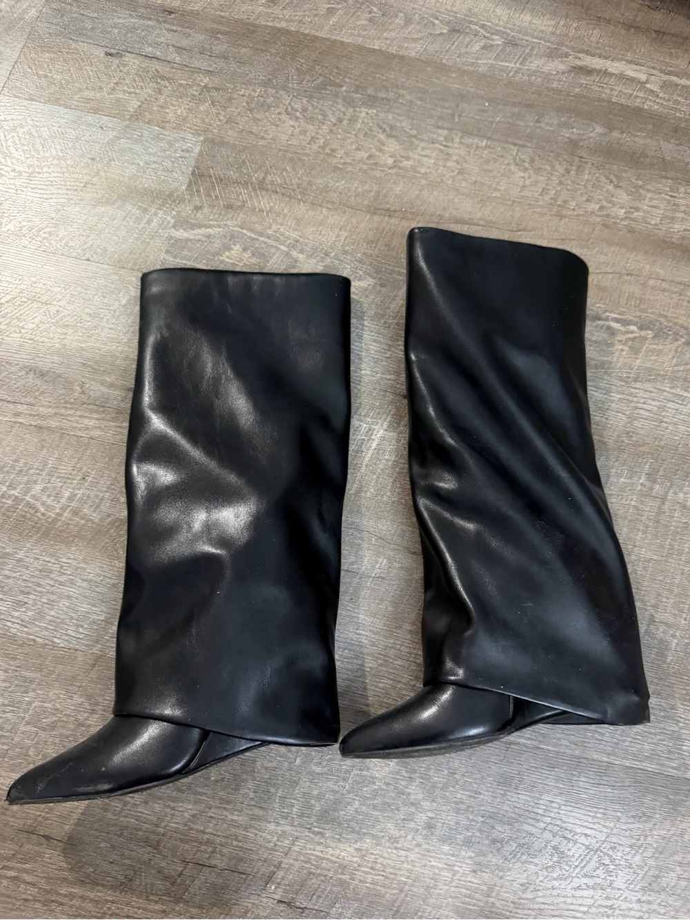 Black leather knee high heeled boots
